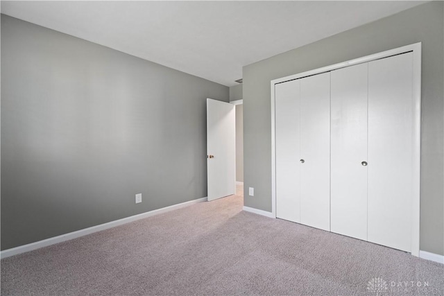1824 Scotch Pine Dr, Beavercreek, OH 45432 - unfurnished bedroom with carpet flooring, a closet, and baseboards
