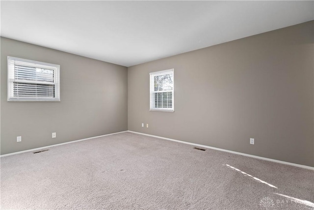 1824 Scotch Pine Dr, Beavercreek, OH 45432 - carpeted spare room featuring baseboards and visible vents
