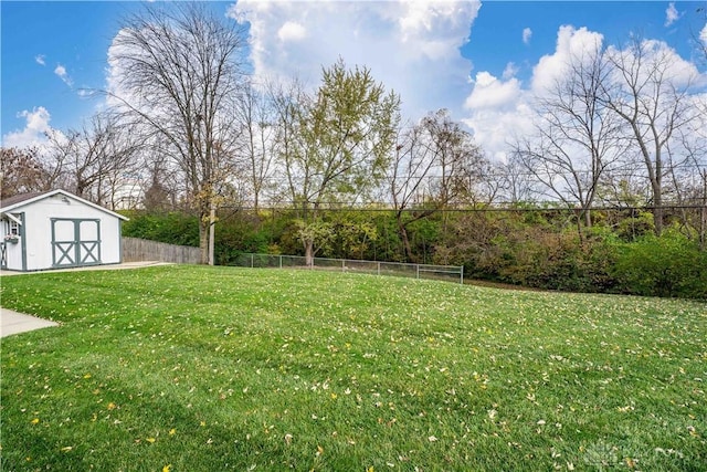 1824 Scotch Pine Dr, Beavercreek, OH 45432 - view of yard with an outdoor structure, a shed, and fence