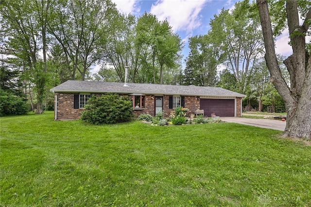 1097 Lynch Rd, Eaton, OH 45320 - ranch-style house with brick siding, an attached garage, driveway, and a front yard