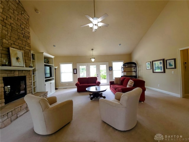 living room featuring carpet flooring, high vaulted ceiling, and baseboards