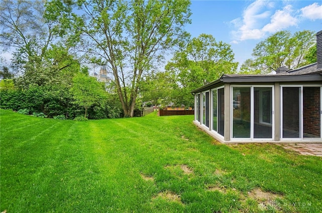5741 Hithergreen Dr, Washington Twp, OH 45429 - view of grassy yard featuring a sunroom