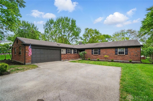5741 Hithergreen Dr, Washington Twp, OH 45429 - single story home featuring a front yard, brick siding, a garage, and aphalt driveway
