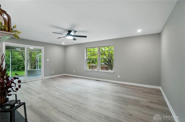 5741 Hithergreen Dr, Washington Twp, OH 45429 - unfurnished living room featuring a ceiling fan, healthy amount of natural light, light wood-style floors, and recessed lighting