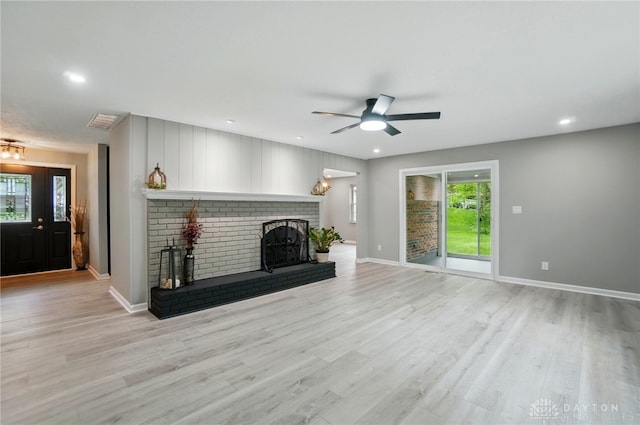 5741 Hithergreen Dr, Washington Twp, OH 45429 - unfurnished living room with a ceiling fan, a fireplace, light wood-style flooring, and recessed lighting