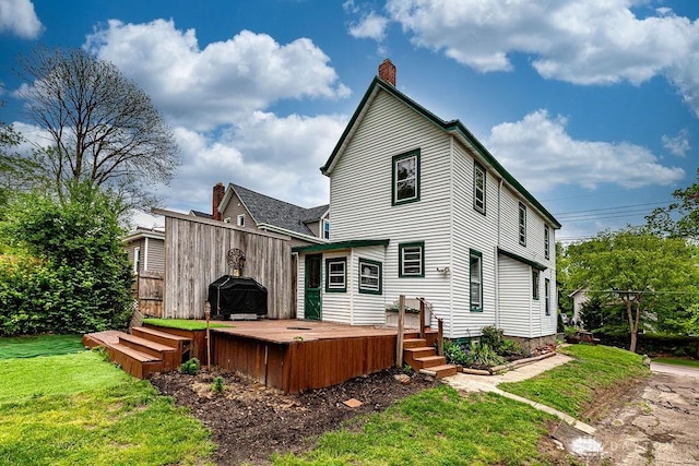 4103 Whetsel Ave, Cincinnati, OH 45227 - rear view of property featuring a lawn, a chimney, and a deck