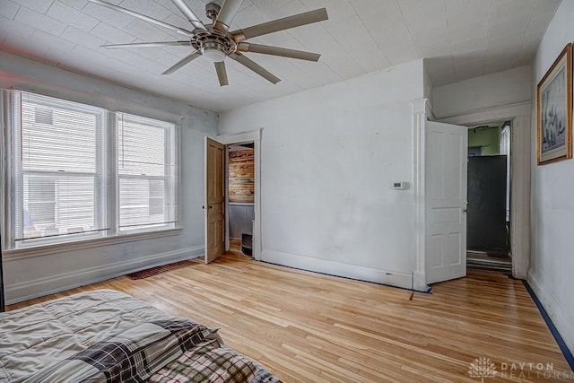 4103 Whetsel Ave, Cincinnati, OH 45227 - unfurnished bedroom featuring baseboards, light wood-style floors, and a ceiling fan