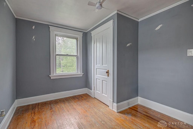 4103 Whetsel Ave, Cincinnati, OH 45227 - unfurnished bedroom with crown molding, light wood finished floors, baseboards, a closet, and ceiling fan