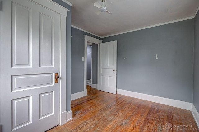 4103 Whetsel Ave, Cincinnati, OH 45227 - unfurnished bedroom featuring baseboards, wood finished floors, and crown molding