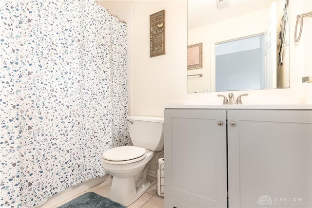 full bath featuring toilet, tile patterned floors, vanity, and a shower with shower curtain