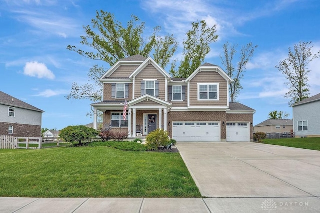1737 Red Clover Dr, Lebanon, OH 45036 - craftsman inspired home with concrete driveway, an attached garage, brick siding, and a porch