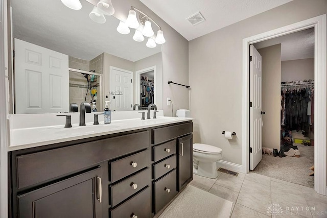 1737 Red Clover Dr, Lebanon, OH 45036 - bathroom featuring a stall shower, toilet, double vanity, tile patterned flooring, and baseboards
