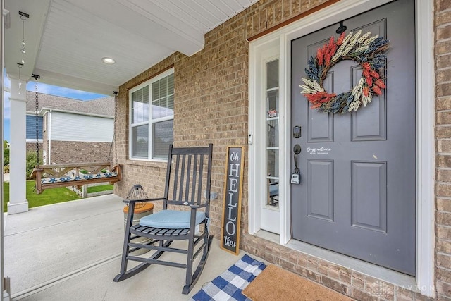 1737 Red Clover Dr, Lebanon, OH 45036 - doorway to property with a porch and brick siding