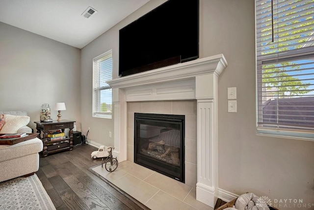 1737 Red Clover Dr, Lebanon, OH 45036 - living area with dark wood-type flooring, a tile fireplace, and baseboards