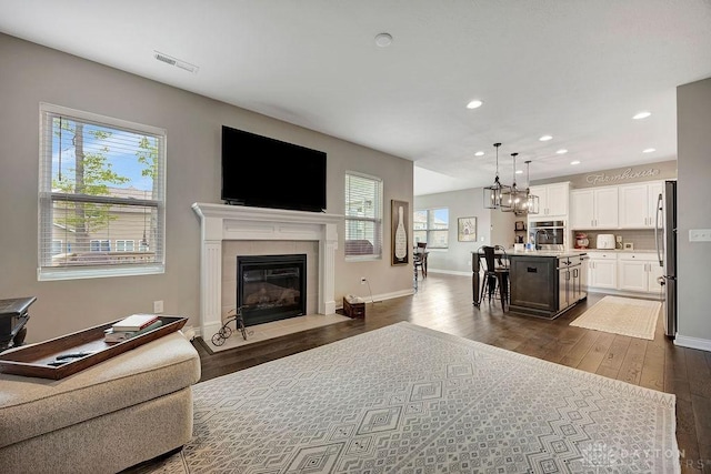 1737 Red Clover Dr, Lebanon, OH 45036 - living room with dark wood-style floors, recessed lighting, a fireplace, and baseboards
