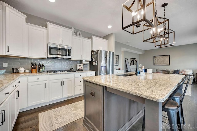 1737 Red Clover Dr, Lebanon, OH 45036 - kitchen with appliances with stainless steel finishes, a sink, a chandelier, recessed lighting, and white cabinetry