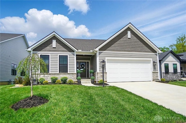 9917 Rothschild Ct, Clearcreek Twp, OH 45458 - craftsman inspired home with stone siding, an attached garage, a front lawn, and concrete driveway