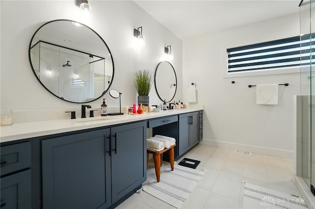 9917 Rothschild Ct, Clearcreek Twp, OH 45458 - bathroom featuring a stall shower, double vanity, and baseboards