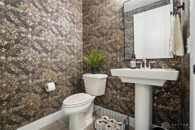 9917 Rothschild Ct, Clearcreek Twp, OH 45458 - half bathroom featuring toilet, tile patterned floors, and baseboards