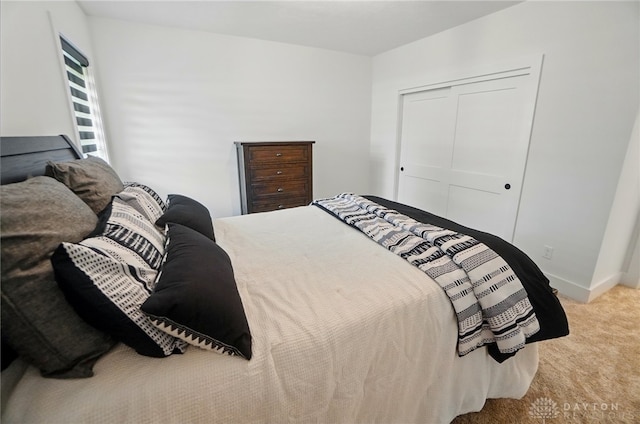 9917 Rothschild Ct, Clearcreek Twp, OH 45458 - bedroom featuring carpet floors, a closet, and baseboards