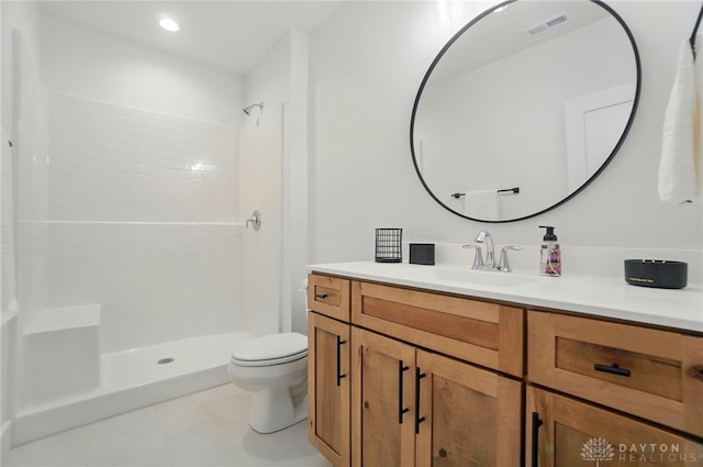 9917 Rothschild Ct, Clearcreek Twp, OH 45458 - full bathroom with toilet, vanity, tiled shower, and recessed lighting