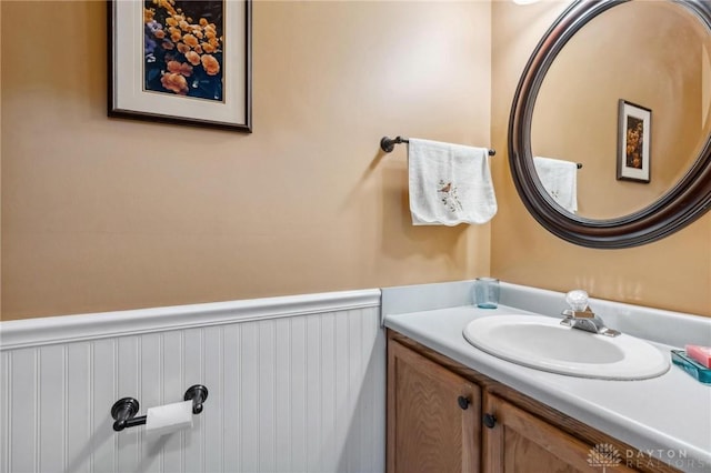 bathroom featuring wainscoting and vanity