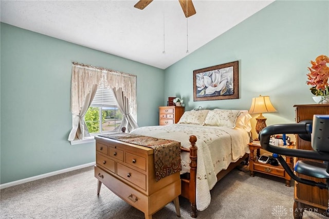 bedroom featuring carpet, baseboards, vaulted ceiling, and a ceiling fan