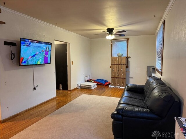 2 Brompton Ln, Cincinnati, OH 45218 - living room featuring wood finished floors, a ceiling fan, and crown molding