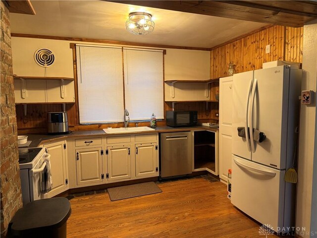 2 Brompton Ln, Cincinnati, OH 45218 - kitchen featuring open shelves, white appliances, dark countertops, wood finished floors, and ornamental molding