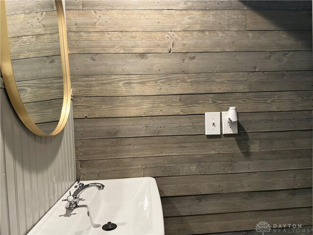 2 Brompton Ln, Cincinnati, OH 45218 - bathroom featuring wood walls and a tub to relax in