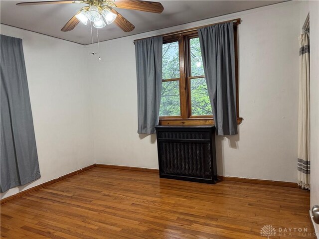2 Brompton Ln, Cincinnati, OH 45218 - spare room featuring a ceiling fan and wood finished floors