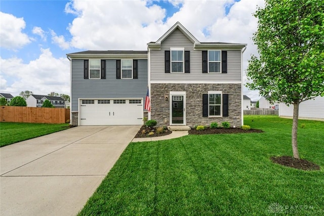 1194 Lisa Marie Dr, Xenia, OH 45385 - view of front of house featuring stone siding, a garage, and driveway