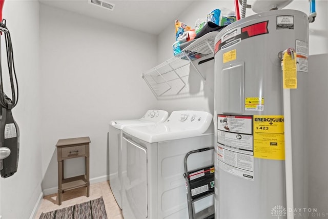 1194 Lisa Marie Dr, Xenia, OH 45385 - laundry room featuring water heater, independent washer and dryer, baseboards, and light tile patterned floors