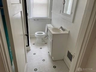 1234 Kumler Ave Unit 1234, Dayton, OH 45402 - bathroom featuring vanity, toilet, and tile patterned floors