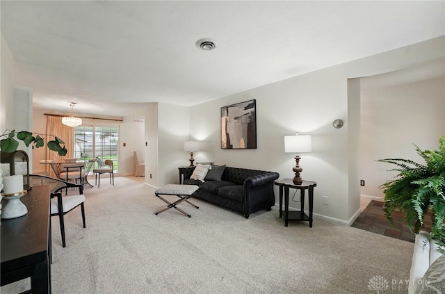 living room with light colored carpet and baseboards