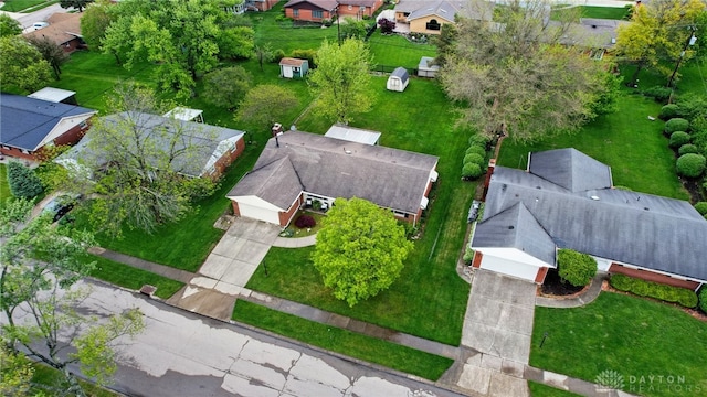 aerial view of property and surrounding area with nearby suburban area