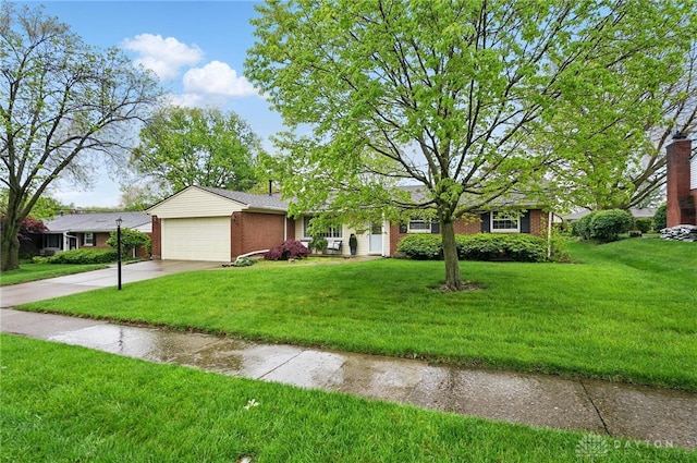 view of front of house featuring brick siding, an attached garage, concrete driveway, and a front lawn