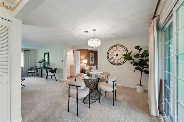 dining room with carpet and baseboards