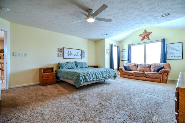 bedroom with carpet flooring, vaulted ceiling, baseboards, a textured ceiling, and a ceiling fan