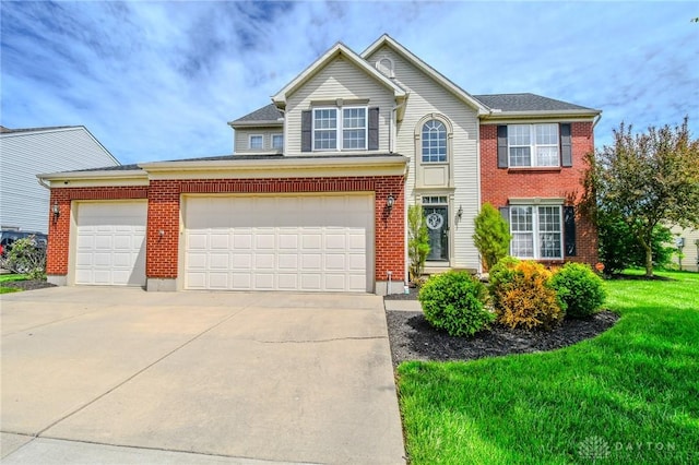 traditional-style home featuring concrete driveway, a front lawn, brick siding, and a garage