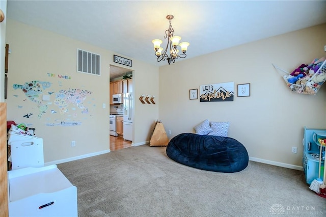 game room featuring a chandelier, carpet floors, and baseboards