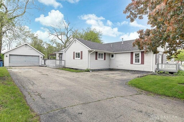 3417 Beechgrove Rd, Moraine, OH 45439 - ranch-style home featuring a detached garage, an outdoor structure, and a shingled roof