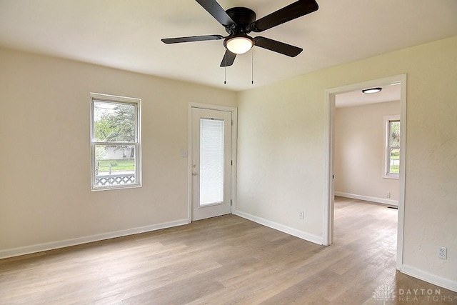 3417 Beechgrove Rd, Moraine, OH 45439 - empty room with healthy amount of natural light, light wood-type flooring, baseboards, and ceiling fan