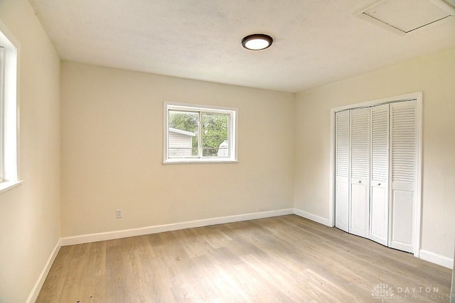 3417 Beechgrove Rd, Moraine, OH 45439 - unfurnished bedroom with light wood-type flooring, baseboards, and a closet