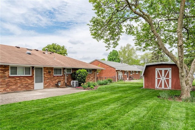 3762 Waterbury Dr, Kettering, OH 45439 - view of yard featuring central AC, a storage shed, a patio, and an outdoor structure