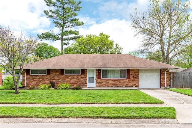 3762 Waterbury Dr, Kettering, OH 45439 - ranch-style home with a garage, concrete driveway, brick siding, and a shingled roof