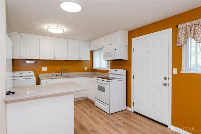 3762 Waterbury Dr, Kettering, OH 45439 - kitchen featuring white appliances, washer / dryer, white cabinetry, light wood finished floors, and a sink