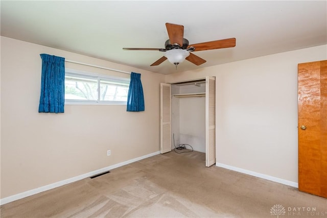 3762 Waterbury Dr, Kettering, OH 45439 - unfurnished bedroom featuring a closet, carpet flooring, baseboards, and a ceiling fan