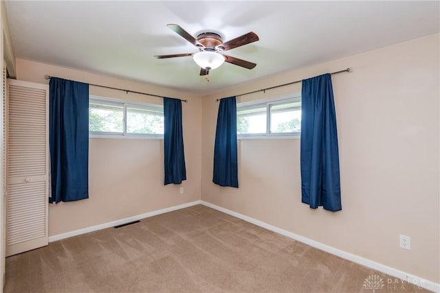 3762 Waterbury Dr, Kettering, OH 45439 - empty room with ceiling fan, plenty of natural light, baseboards, and carpet floors
