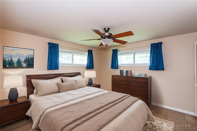 3762 Waterbury Dr, Kettering, OH 45439 - bedroom with baseboards, multiple windows, wood finished floors, and ceiling fan